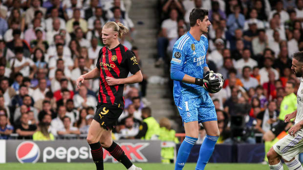 Erling Haaland de Manchester City y Thibaut Courtois de Real Madrid